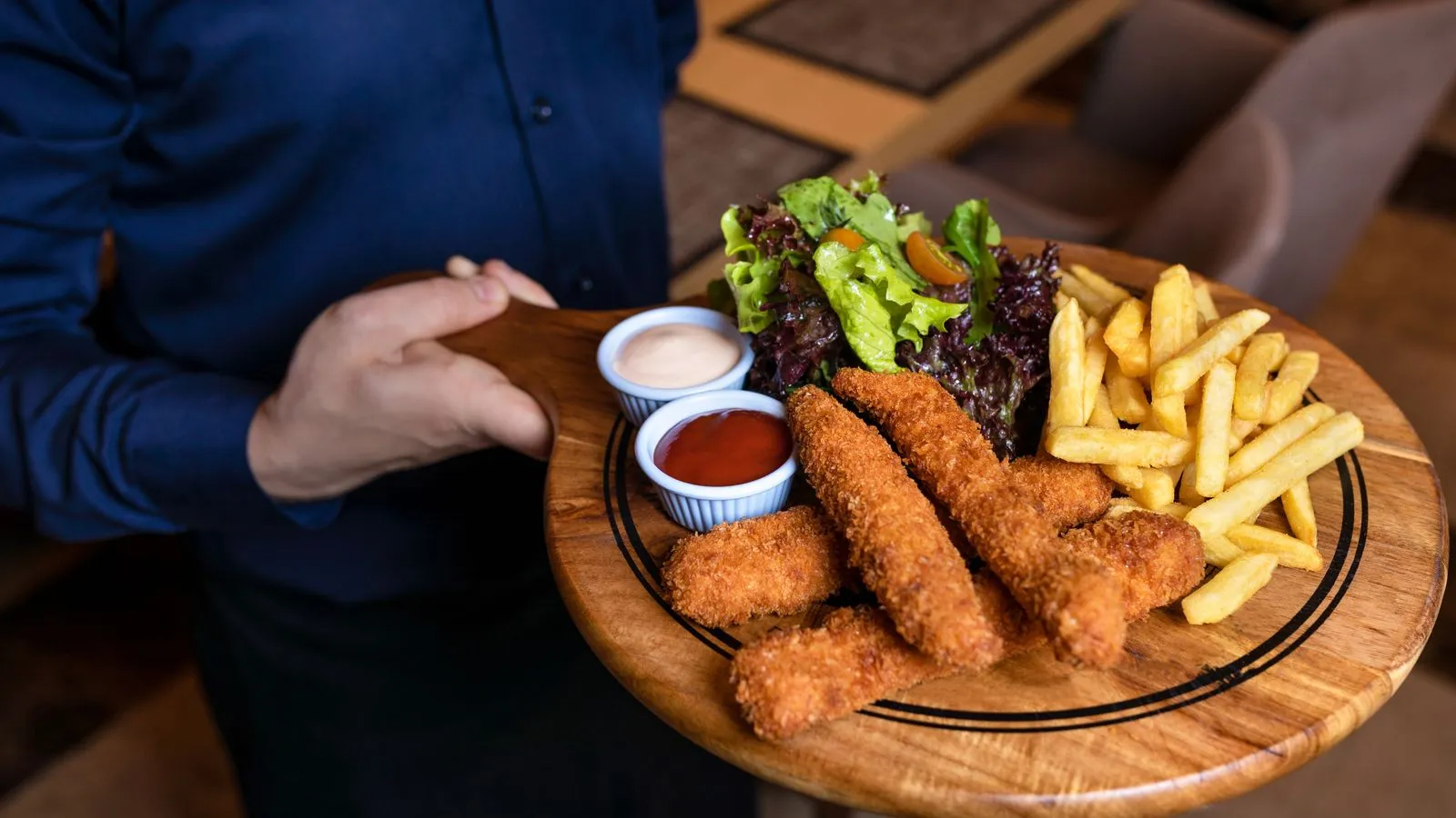 A fried fish platter with fries.