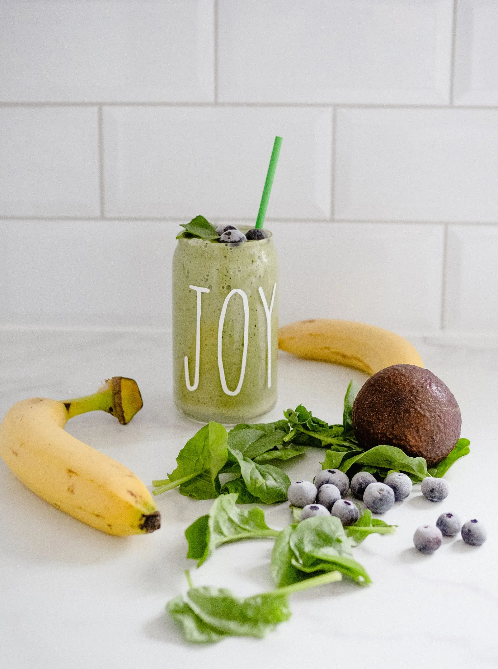 Representative fresh blended smoothie with banana and fruit.